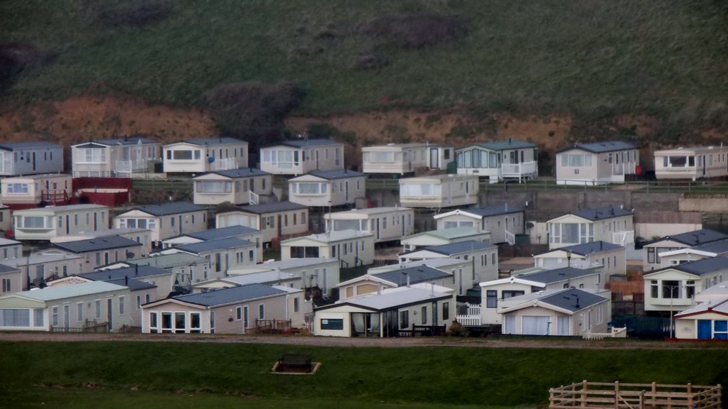 Rows of campers and caravans parked at a holiday park