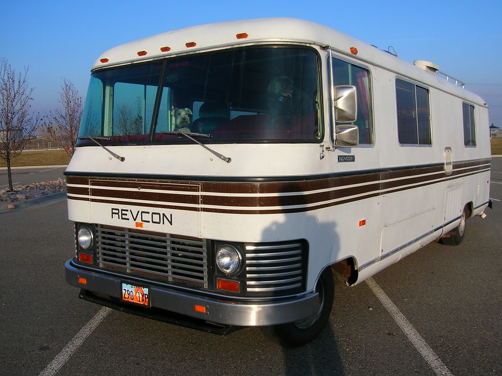Front view of a Class A motorhome showing its large curved windshield and cab