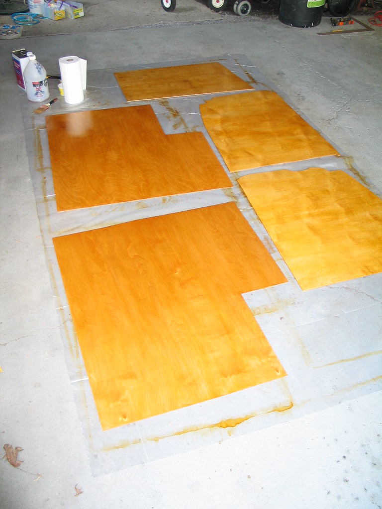 Replacement RV floor panels cut and sealed, ready to reinstall over a repaired subfloor