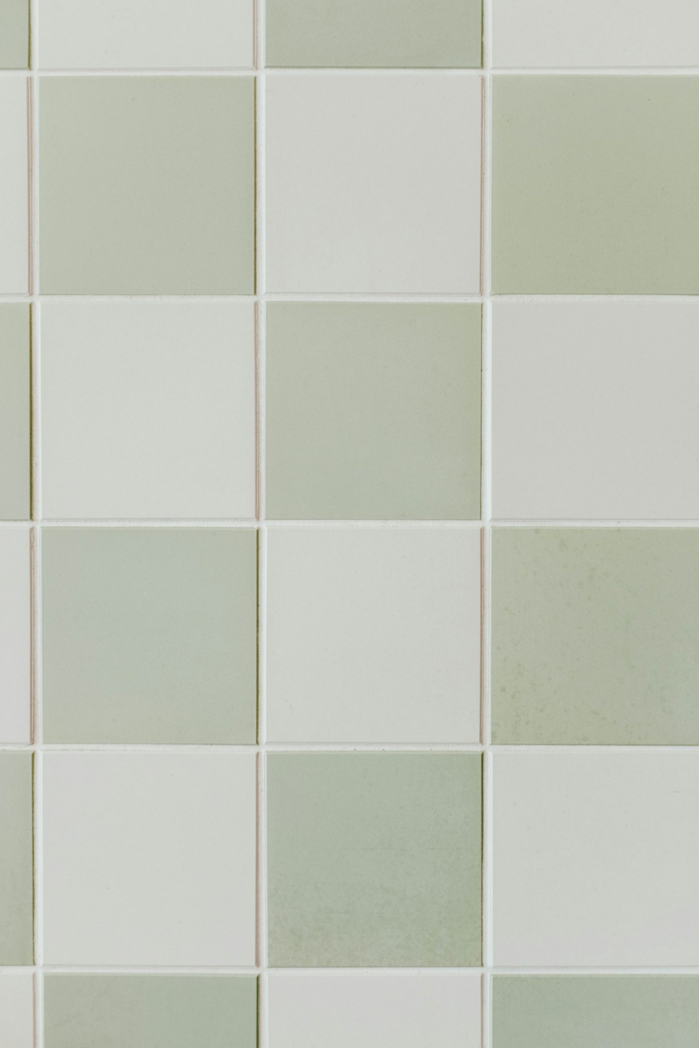 A geometric pattern of gray and white tiles