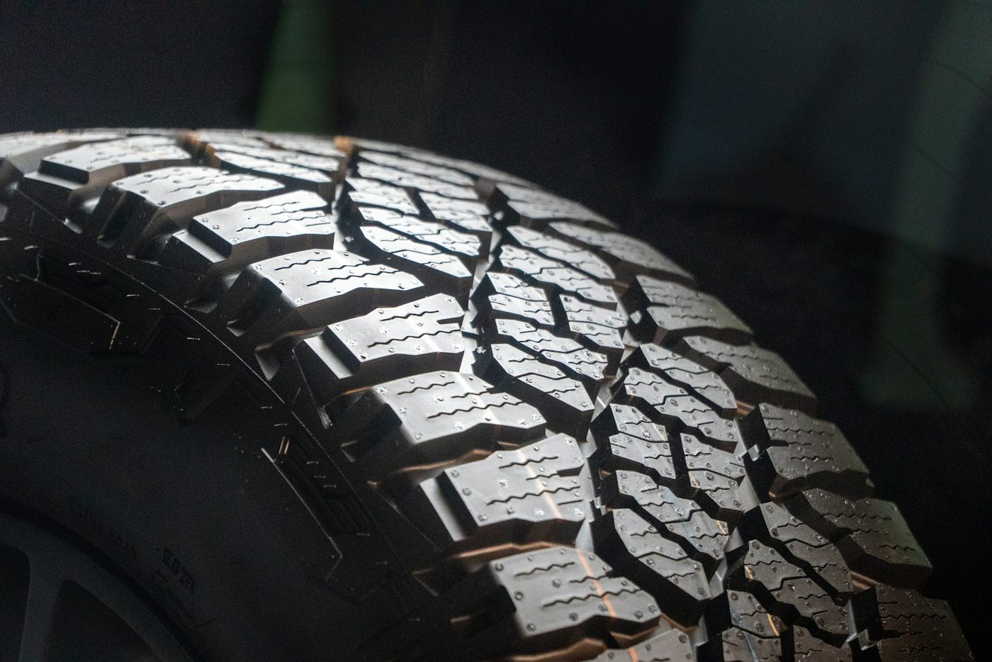 Close-up of an aggressive all-terrain tire tread pattern