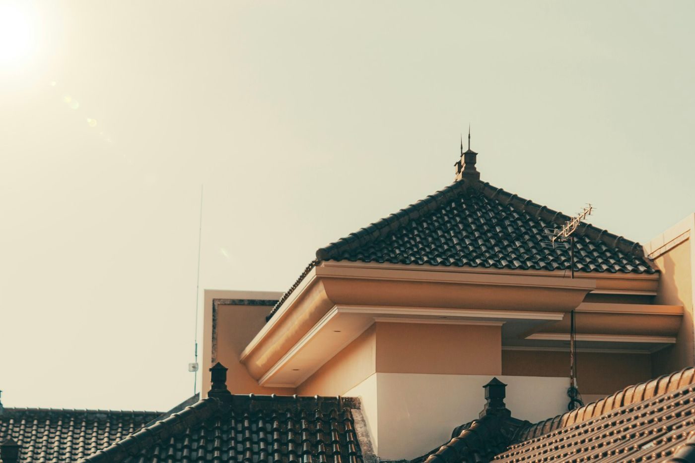 A tiled roof under bright, direct sunlight