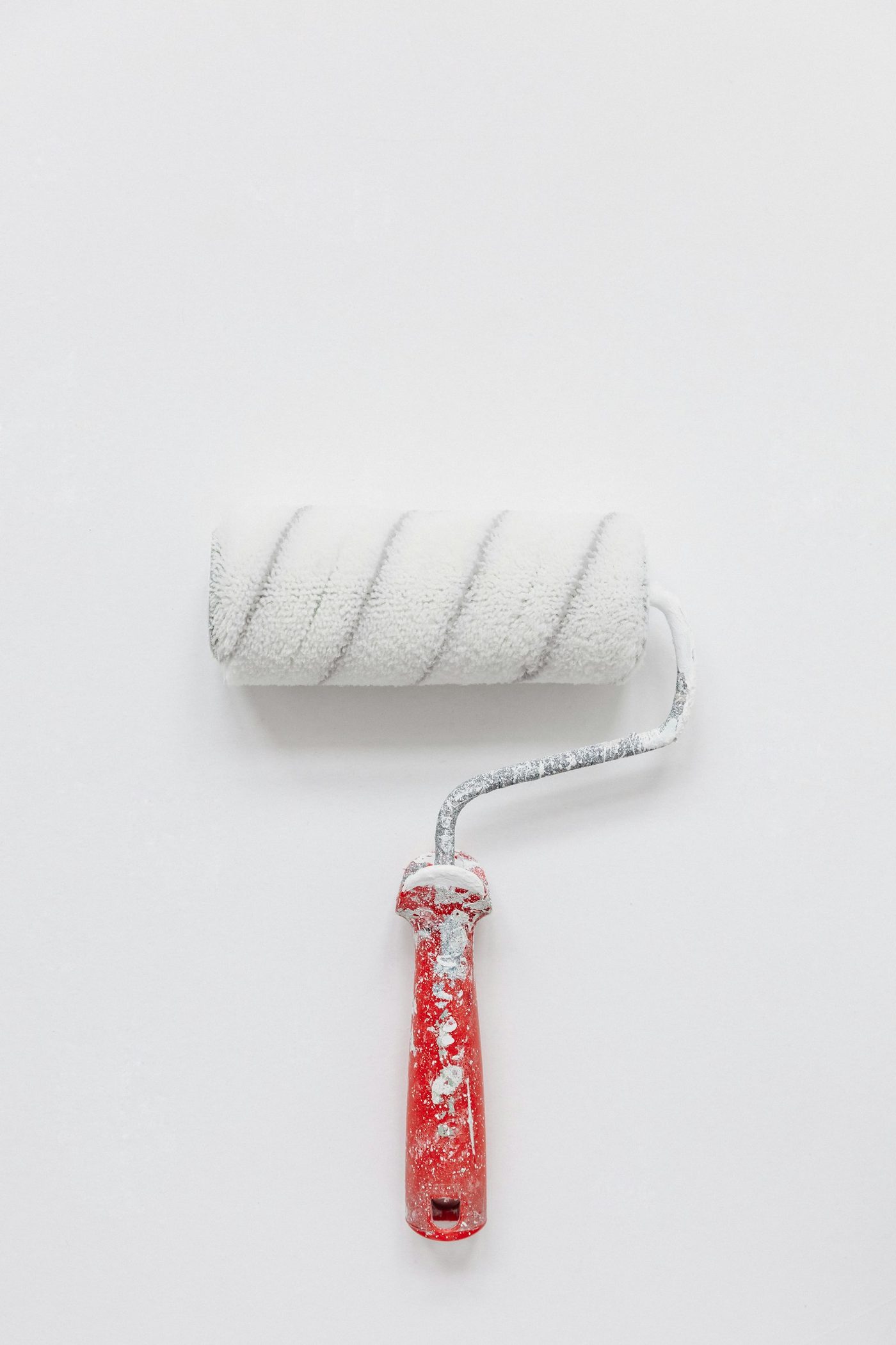 A close-up of a white paint roller