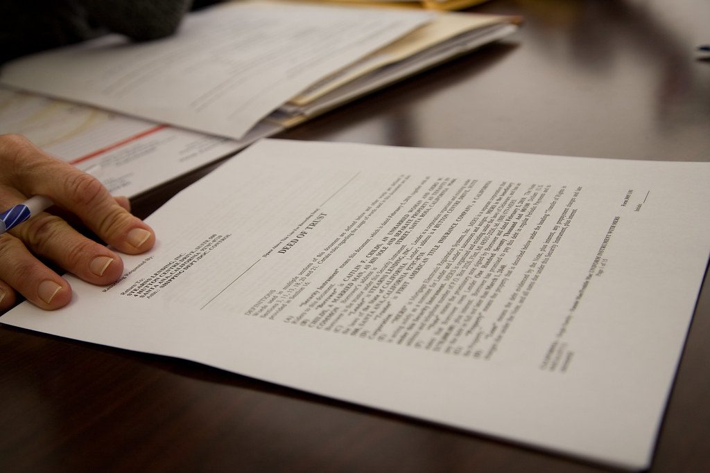 Signing an insurance document, where the policy's wear-and-tear exclusions decide a water-damage claim